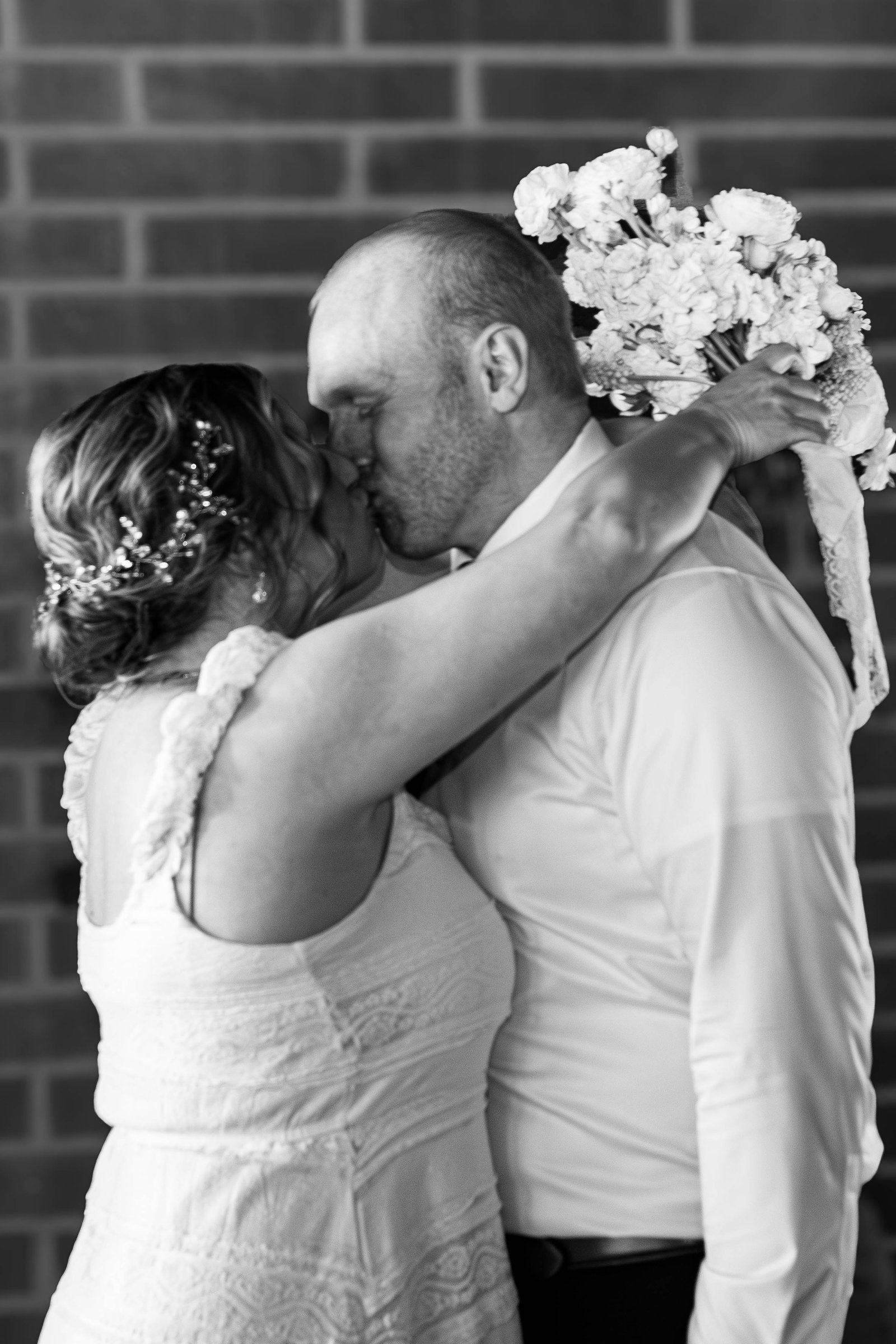 Kissing under the wedding veil